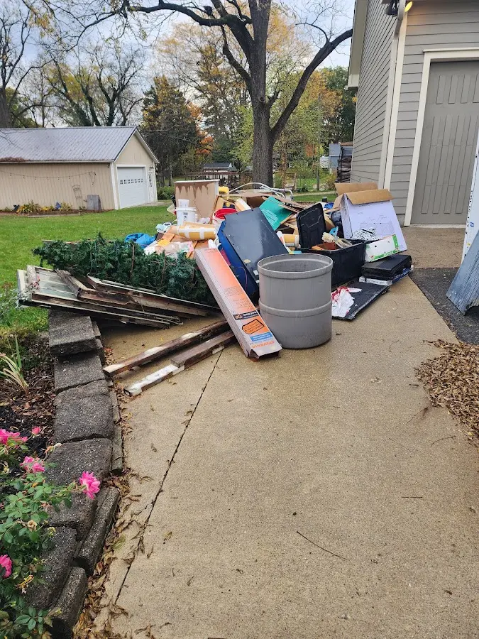 Dumpster being loaded with debris for Estate Cleanout Dumpster Rental in South Orange Village